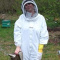 Why should beekeepers wear protective clothing?