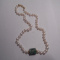 carved jade barrel / pearl necklace / 14kt gold clasp